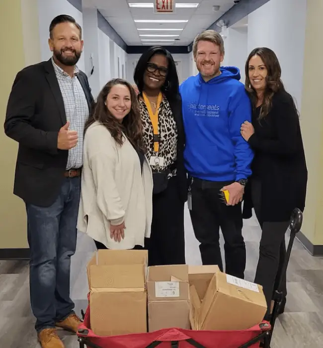 Patrick Booth delivering school supplies to Easterseals Academy